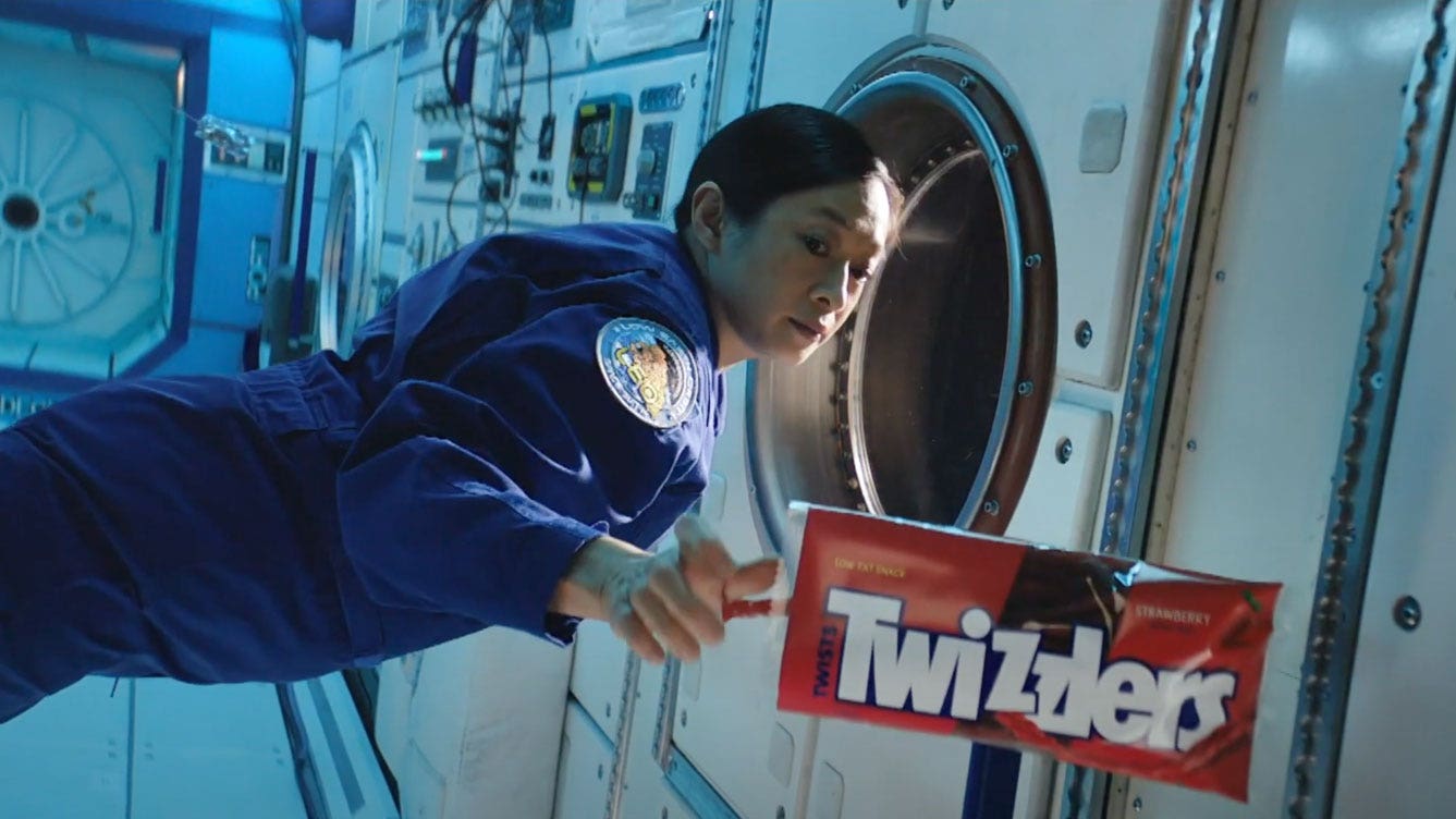 Astronaut grabbing twizzlers