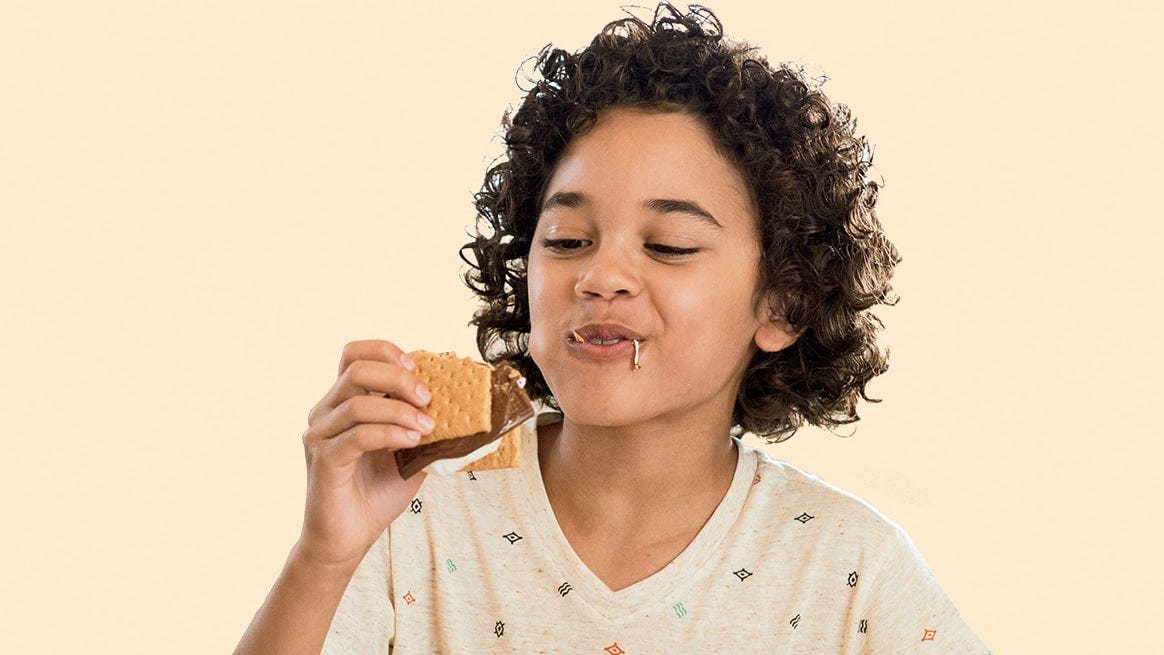 Person eating a smore