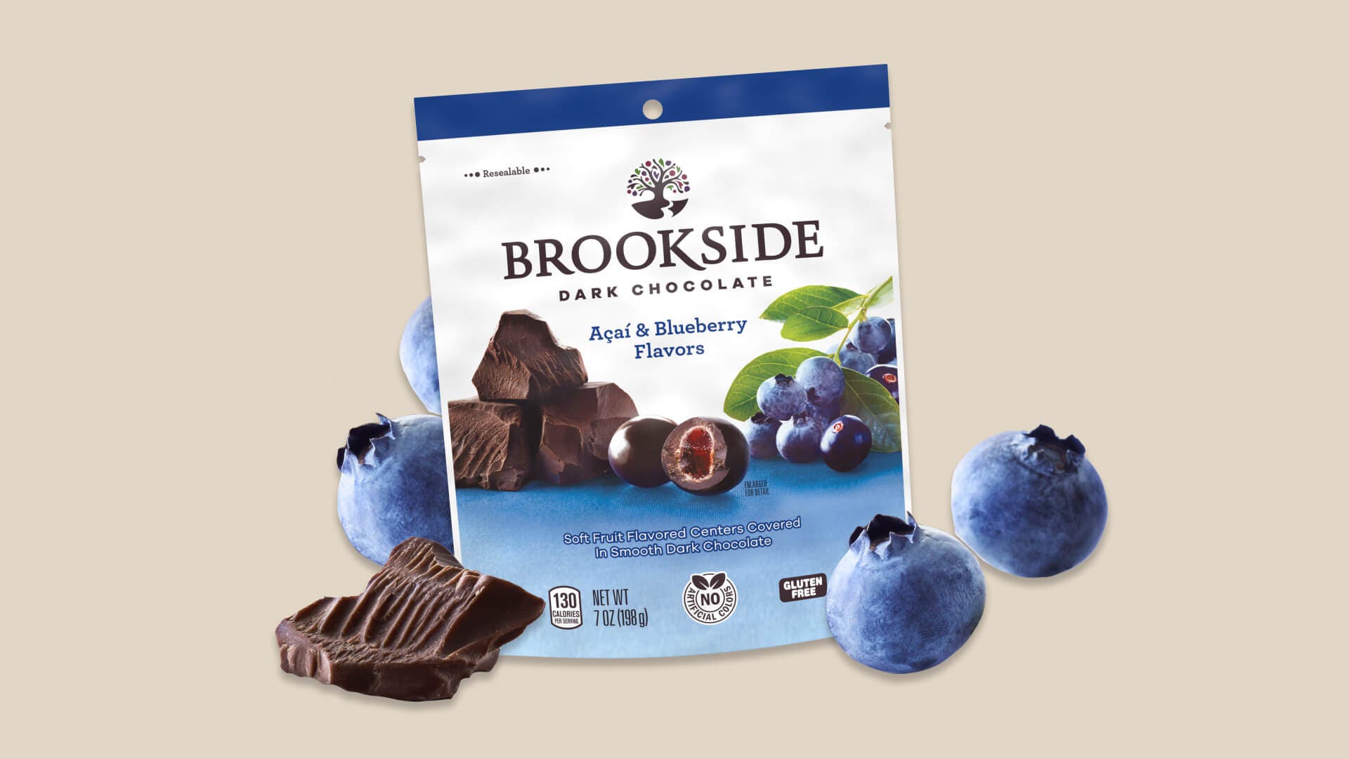 bag of brookside dark chocolate candy beside fresh blueberries and dark chocolate chunks