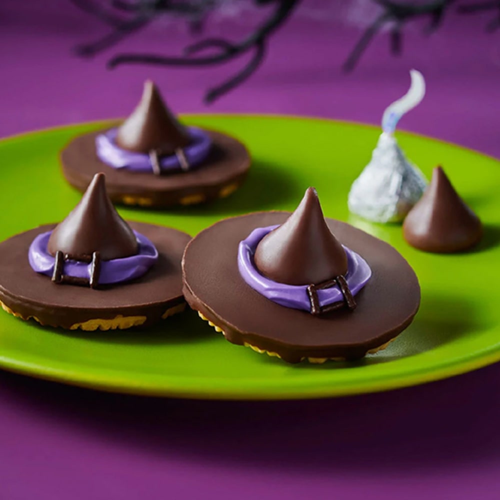 plate of hersheys kisses witch hat cookies