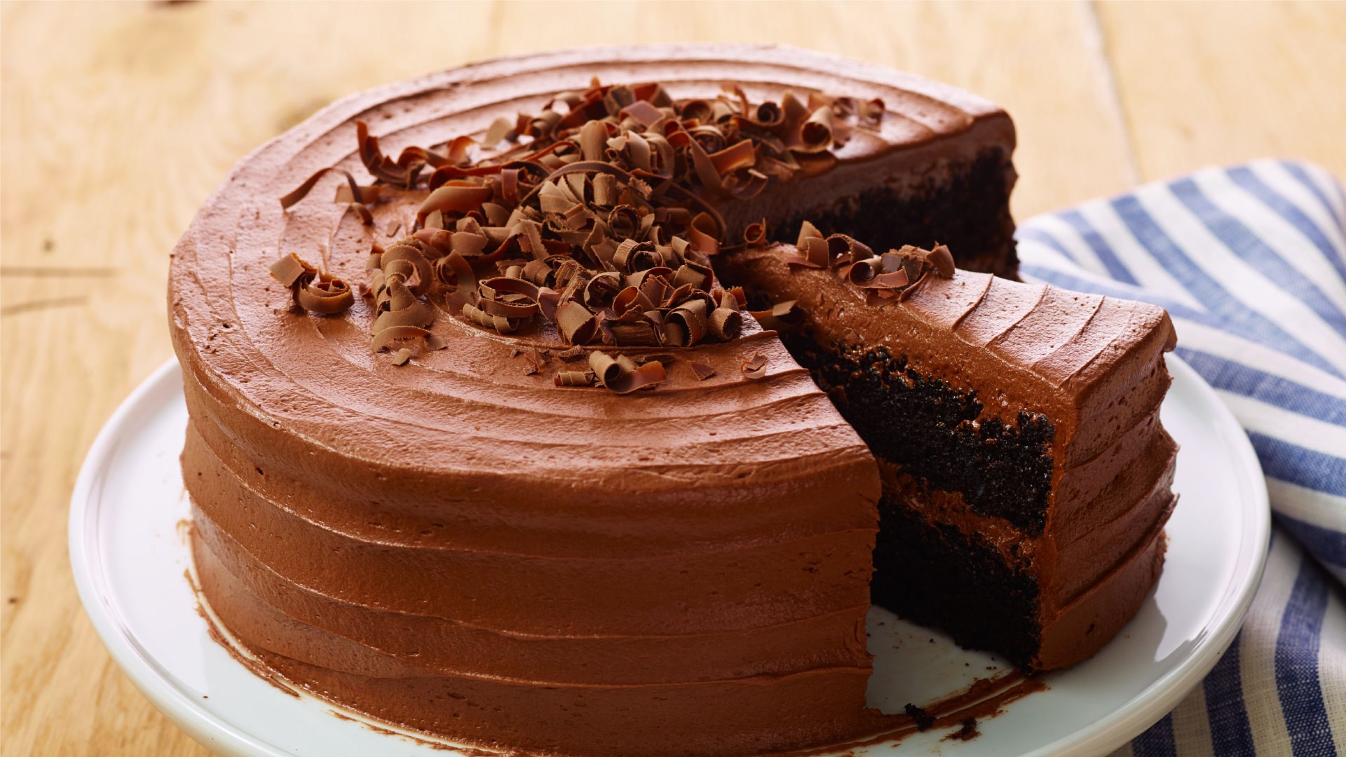 iced chocolate cake with a few slices removed
