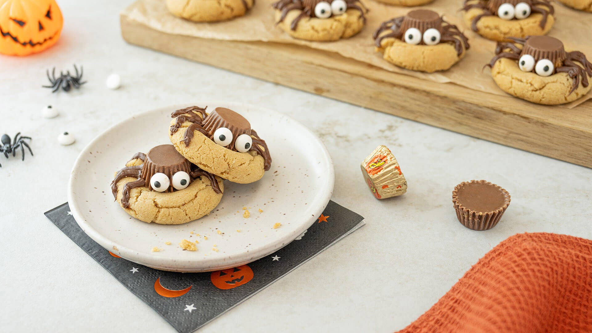 two reeses spider cookies stacked on top of eachother
