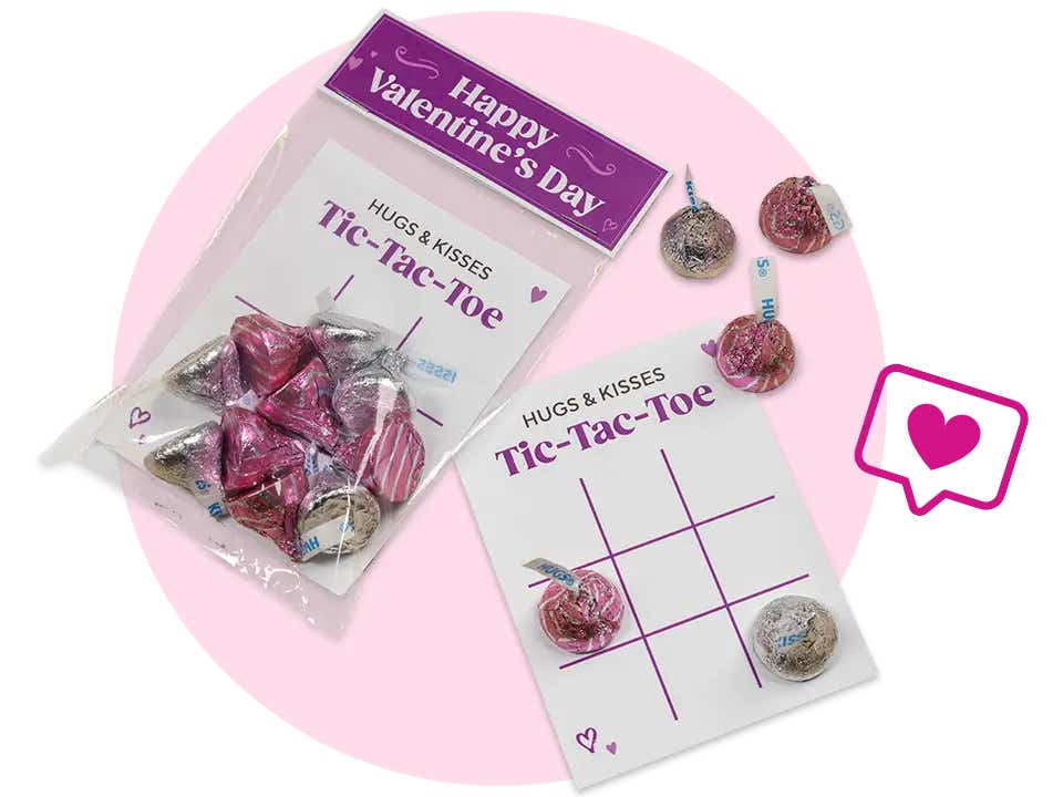 pair of valentines day tic tac toe cards topped with hersheys hugs and kisses candies